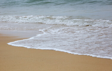 The ocean is calm and the waves are small