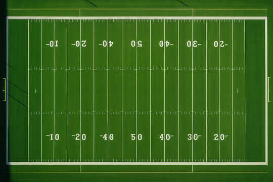 American football field with green grass and white lines on a sports ground - Powered by Adobe