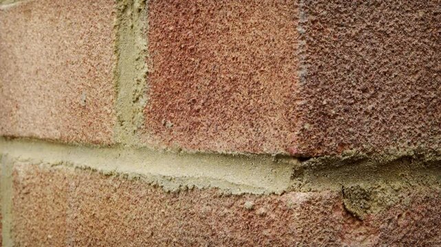 Red brick wall sliding shot close up stock footage.