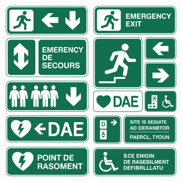 Collection of Green Emergency and Safety Signs featuring Directional Arrows People Icons and Defibrillator Symbols including French and English Text indicating Emergency Exits First Aid and 1
