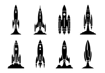 Vector silhouette of collection of eight stylized rocket ship icons in black silhouette, isolated on white background