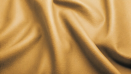 Fototapeta premium Golden, soft silk satin fabric with a smooth, shiny texture creates a luxurious and elegant golden textile background pattern