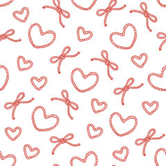 Seamless pattern with hearts of rope and corde bows with knot tied. Vintage print for fabric, wallpaper or wrapping paper. Cowboy or nautical print design