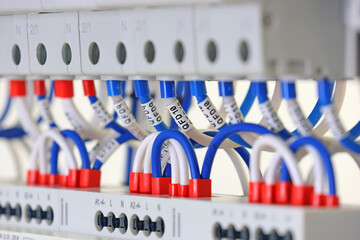 Marking electrical wiring wires with thermally printed nylon tape. 