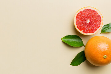 fresh Fruit grapefruit with Juicy grapefruit slices on colored background. Top view. Copy Space....