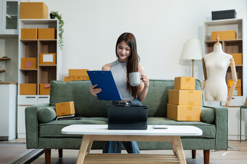 Woman start up online seller owner at workplace. small business entrepreneur SME or freelance asian...