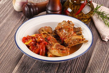 Baked lamb ribs with vegetables