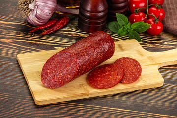 Spicy pepperoni sausages with sliced piece