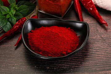 Spicy dry paprika powder in the bowl