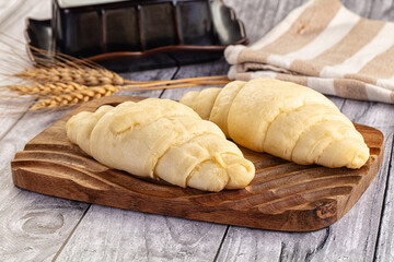 Raw uncooked croissant for bake