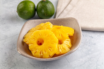 Sweet canned pineapple slices in syrope