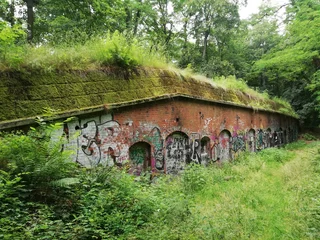 Old bunker in a park. Green ruins. © Jakub