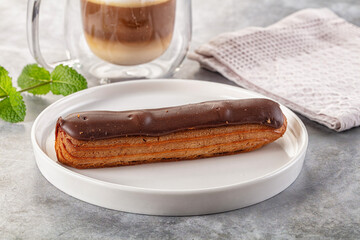 Gourmet chocolate eclair with icing