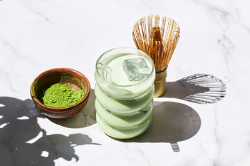 Iced Matcha Refreshment. Refreshing iced matcha drinks with a bamboo whisk and matcha powder