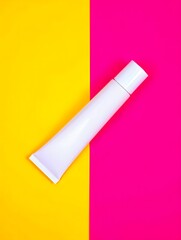 A simple white tube of cream product on a colorful background