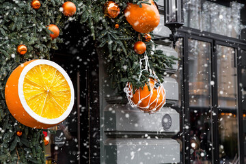 Mandarins in a string bag and Christmas tree decorations on the streets of Moscow. Happy New Year...