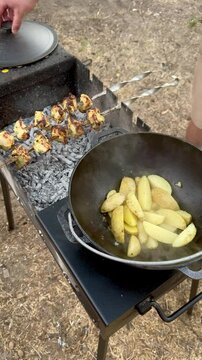Skewers and Potatoes on a Cast Iron Grill