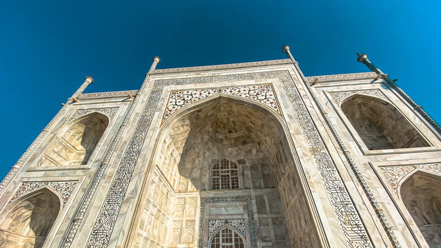 Taj Mahal, India. Architectural details of the Taj Mahal. Taj Mahal is a mausoleum made of white marble located in the city of Agra. - Powered by Adobe