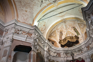 Baroque interior of the church with rich symbolic decor, fresco, sculptures of skeletons and...