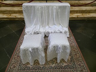 church wedding white chairs detail