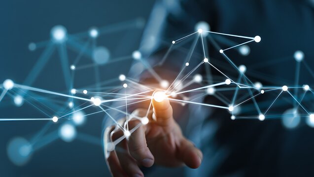 Human finger touching a glowing node in a complex digital network system