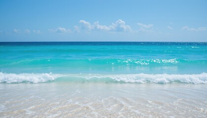 electric blue toned summer beach scene with small waves and crystal clear water under a blue sky on a sunny day.