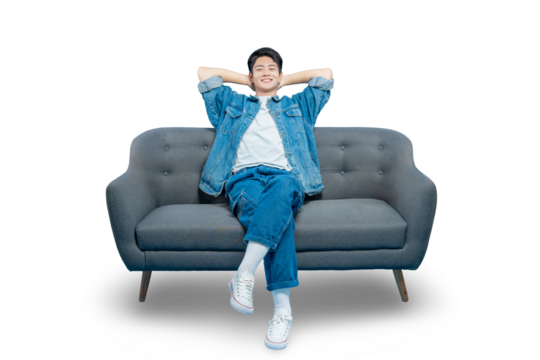 A happy young man leans back on the couch with his hands behind his head, enjoying a moment of pure relaxation,PNG