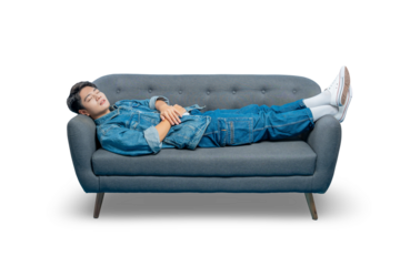 Asian man in casual clothes is sleeping peacefully while lying on a sofa, representing rest and relaxation.PNG