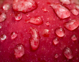 A red apple with drops of water on it