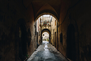 Old Arched Alleyway with Light and Shadows in Sicily