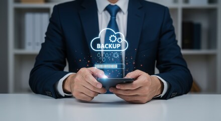 Photo of a businessman is using his smartphone to backup his data to the cloud