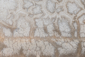 Texture gray cement wall with black stain and crack