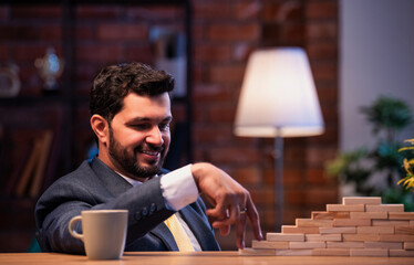 Asian corporate professional climbing block steps, representing growth and leadership journey