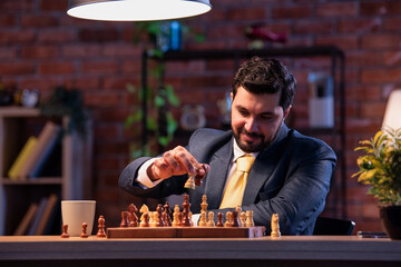 Indian executive playing chess in office, symbolizing business strategy and leadership planning