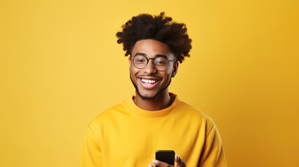 Young cute African American man smiling wearing casual clothes and headphone enjoying listening music overisolated on plain yellow background studio with copy space. Lifestyle concept