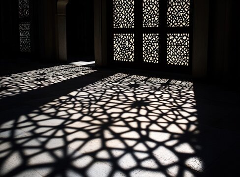 Shadow patterns of lattice on floor, sunlit space