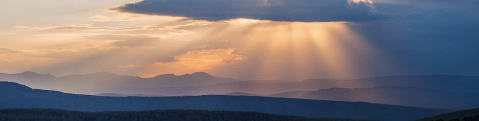 Sunset sky in the mountains, panoramic view	