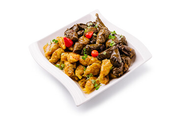 Delicious dish of stuffed grape leaves and savory meat rolls served elegantly