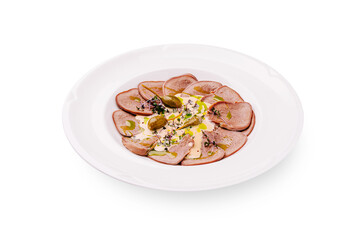 Delicate presentation of gourmet beef carpaccio on a white plate