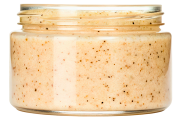 Open glass jar of natural cosmetic body scrub for skin care isolated with transparent background