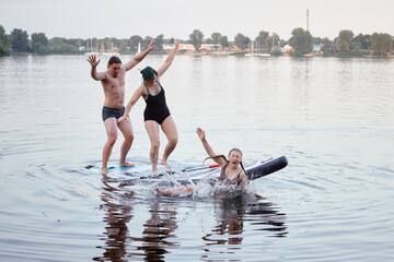 Group of Friends Enjoying a Fun Paddleboarding Activity on a Lake