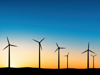 Obraz premium Silhouettes of six wind turbines stand against a vibrant sunset sky with gradients of orange and blue.