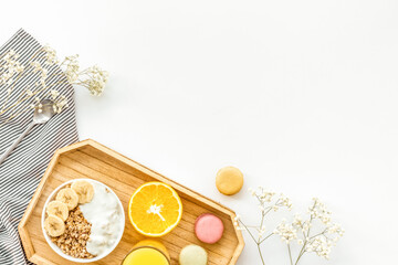 Bright breakfast with granola and orange juice on white background top view mockup