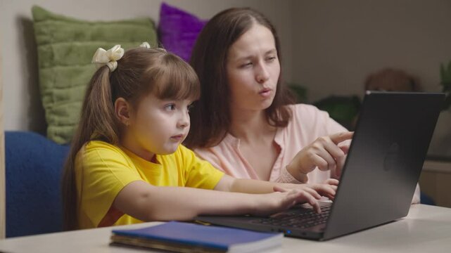 parent with child does homework together. happy family. daughter receives education computer online. digital children modern pc. hands kid type keyboard. connection between teacher student. elementary