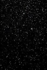 Obraz premium Shimmering, vertical streaks of light cascade down a pitch-black background, resembling a glittering, ethereal rain or snowfall