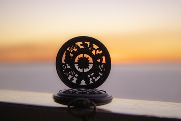 Compass and sunset