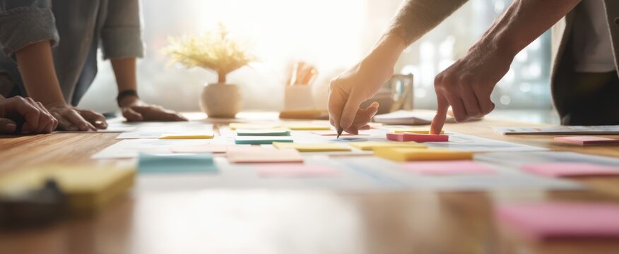 The collaborative team engages in brainstorming with colorful sticky notes.