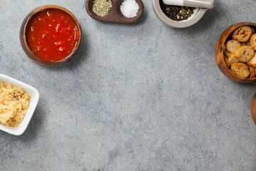 Ingredients in bowls arranged on gray table