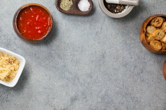 Ingredients in bowls arranged on gray table