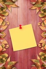 Fototapeta premium Autumn leaves with yellow note